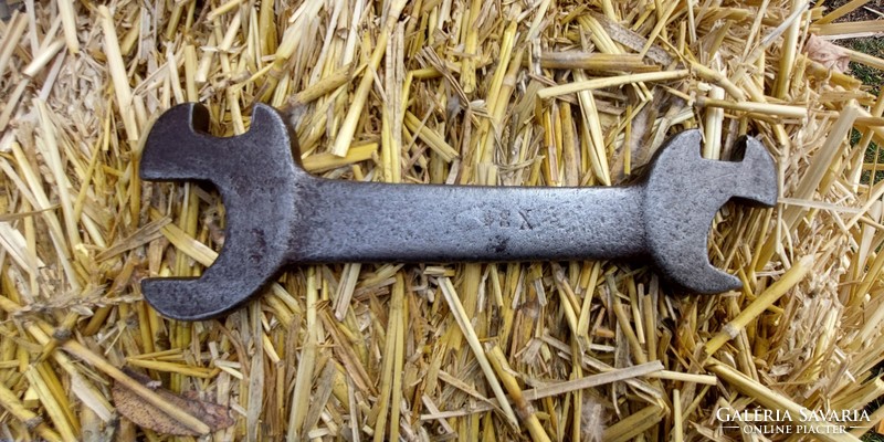 Old wrench with x 34 marking.