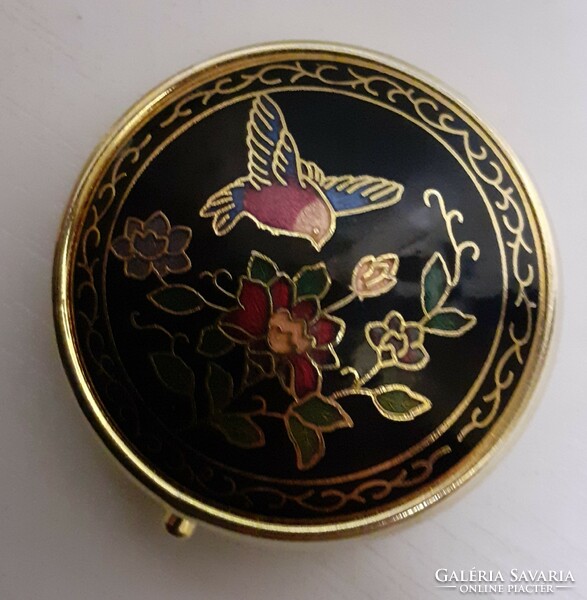 A small box of slenze that can be carried in a bag studded with a fire enamel inlay on a gilded chiselled top