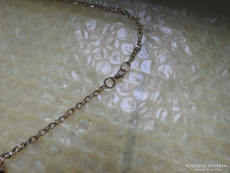 Golden daisy pendant on a chain