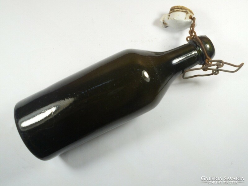 Old antique dark green glass bottle with buckle - 23 cm high, approx. 0.5 l approx. From the 1920s