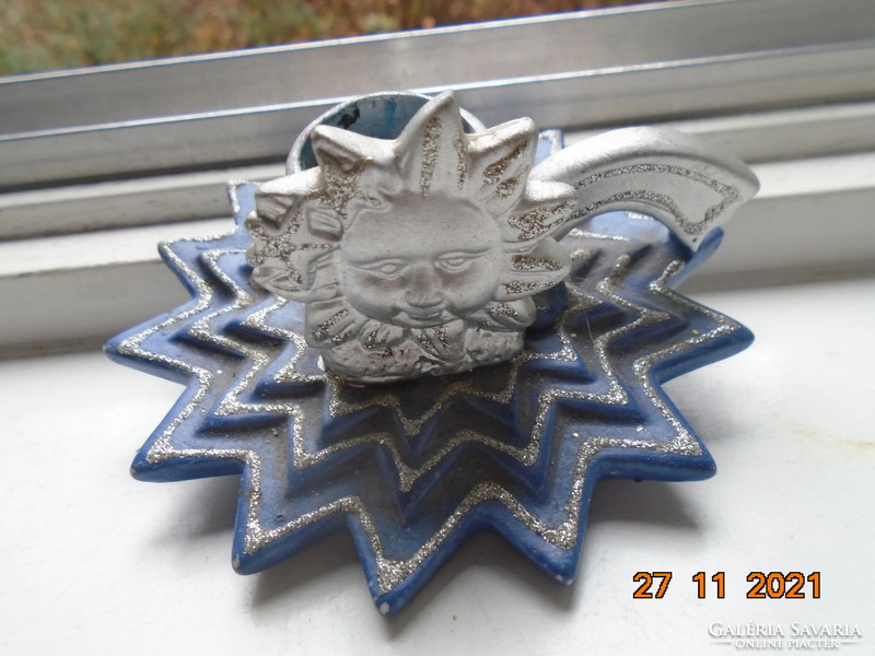 Christmas candle holder with a blue star base and a silver-plated sunburst face