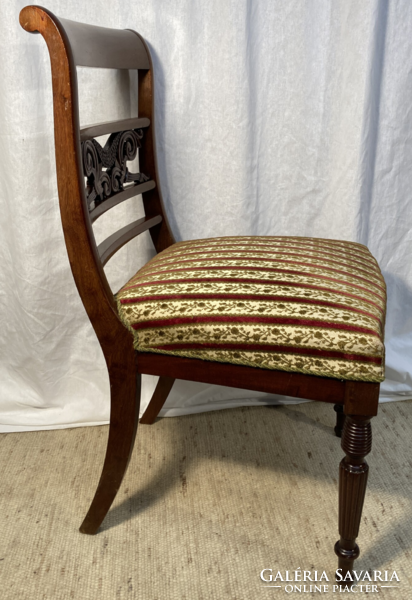 Mahogany chair with upholstered carved back