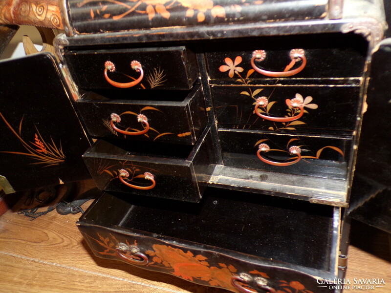 A 19th-century Japanese lacquered wooden chest with many drawers