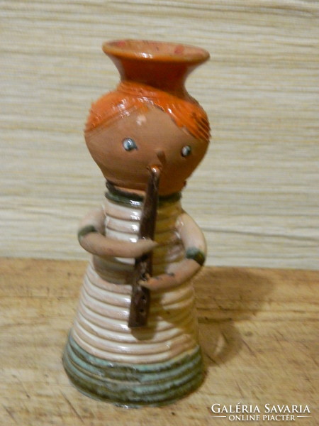 A slightly pink Ilona ceramic flute player