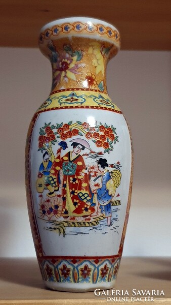 A small vase with an oriental motif.