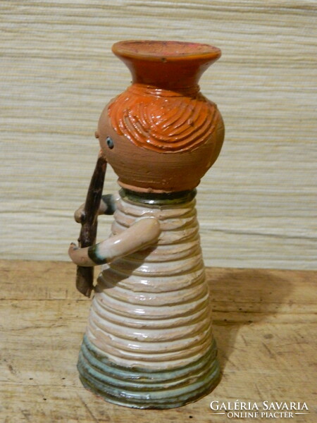 A slightly pink Ilona ceramic flute player