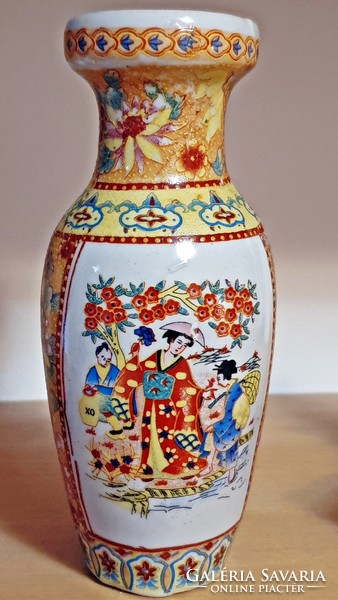 A small vase with an oriental motif.