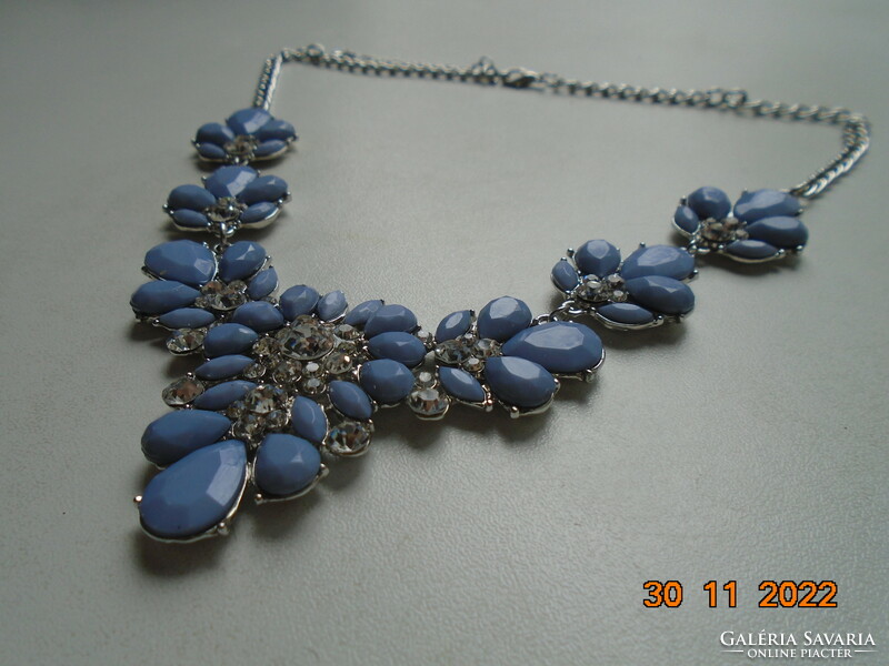 Faceted pale blue with purple stones in a silver-plated socket, flower necklace