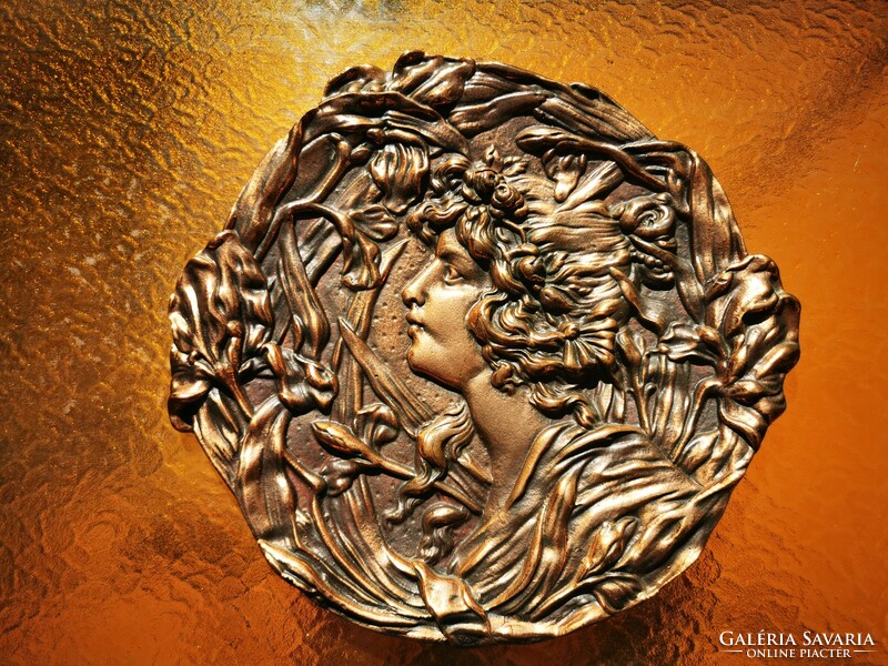Art Nouveau female head, relief
