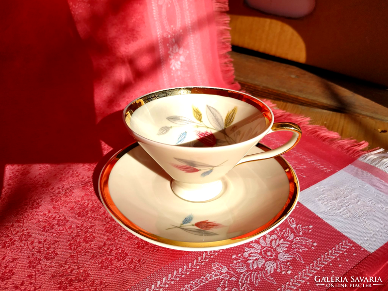 Graceful porcelain coffee cup with saucer