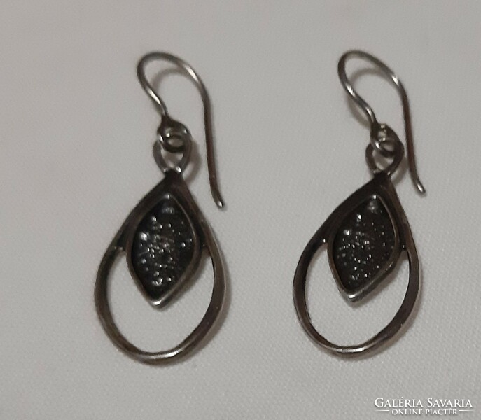A beautiful pair of hammered marked silver earrings
