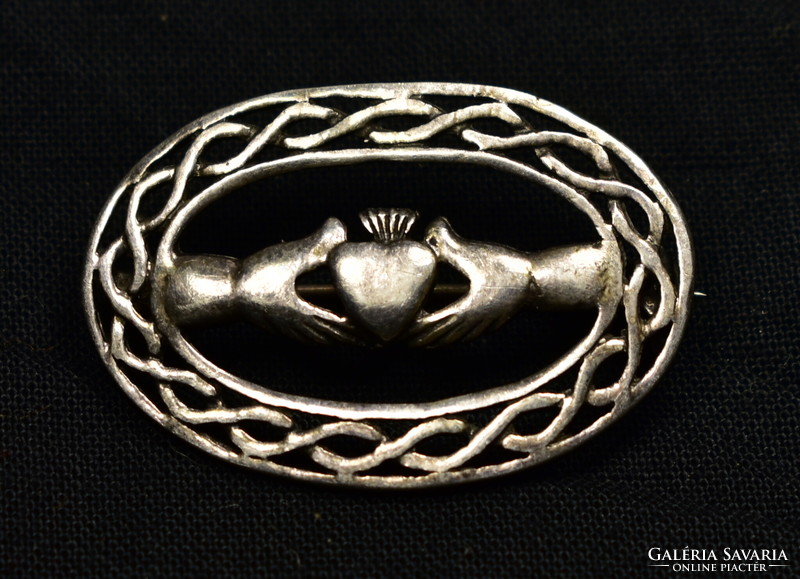 Pierced silver brooch with 