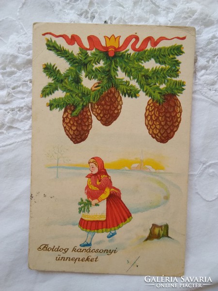Old graphic Christmas postcard / greeting card with woman in traditional costume, cone, pine branch circa 1930