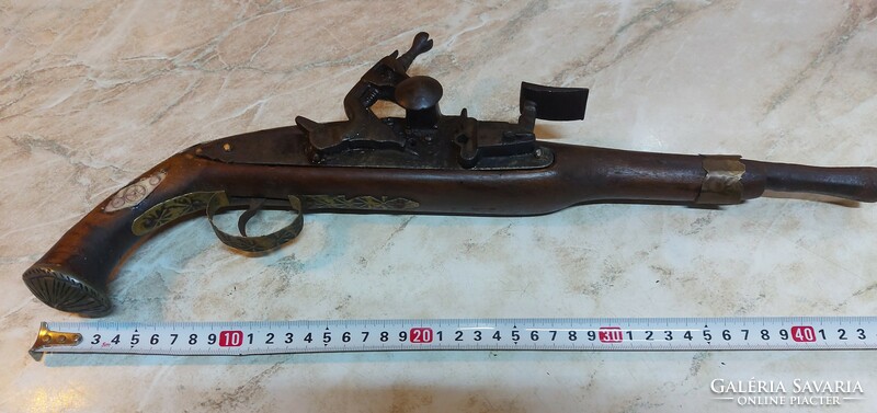 47 Cm smooth barrel, as far as I know, nomad flintlock pistol from the Balkans or the Middle East.