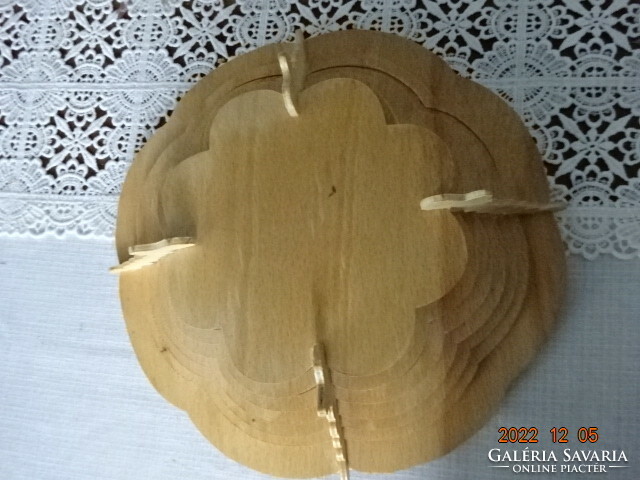 Wooden table centrepiece, with a burnt-in rose pattern in the middle. He has!