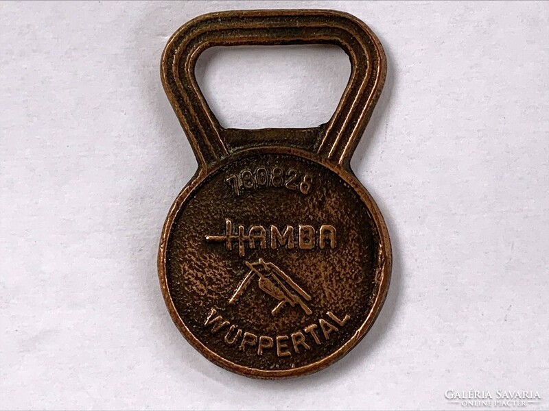 Copper beer opener, written in several languages: for your health