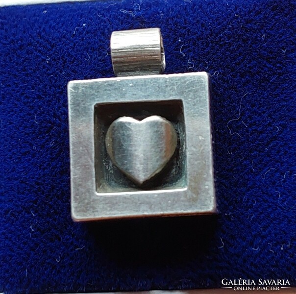 Beautiful silver pendant with a heart motif