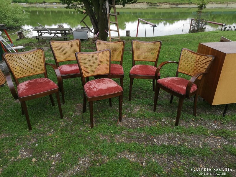 6 chairs with red covers