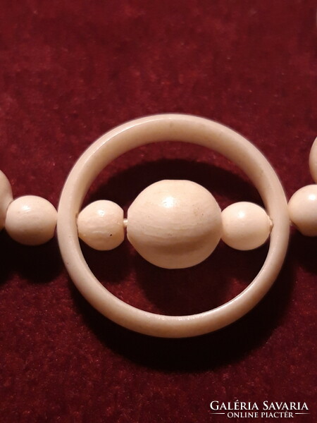 Carved bone necklace with ring decoration - 60 cm