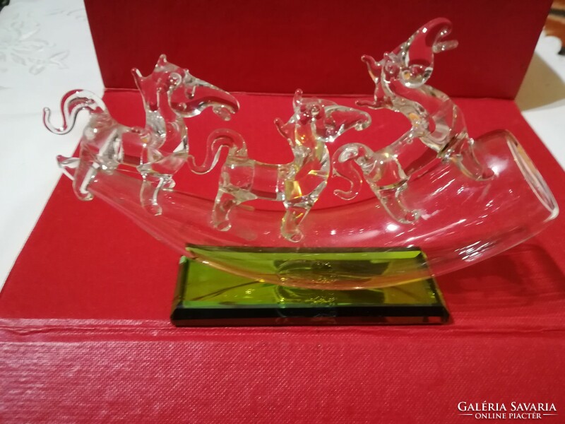 Handmade glass ornament with horses.