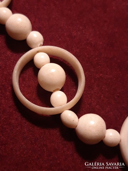 Carved bone necklace with ring decoration - 60 cm