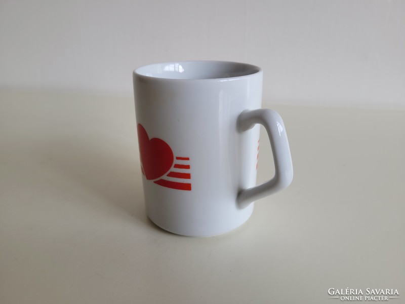 Retro zsolnay porcelain mug with red heart pattern on old tea cup
