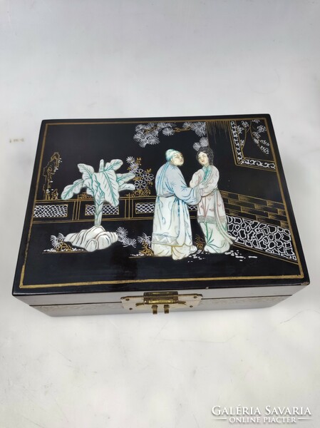 Old Chinese jewelry box with mother-of-pearl decoration and apple green inner lining