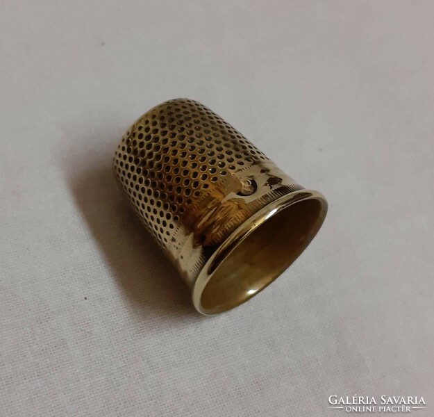 Old brass thimble in good condition