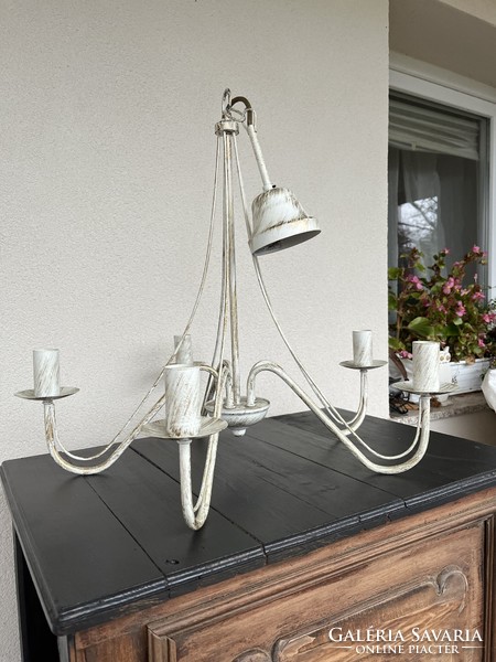 Chandelier made of metal, on an off-white base, antiqued with antique gold