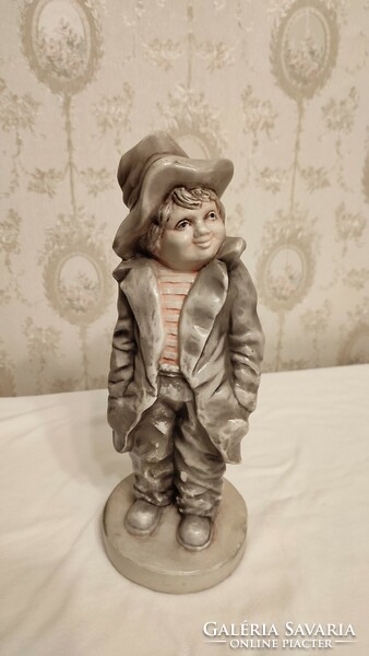 Porcelain boy with a hat, 30 cm high