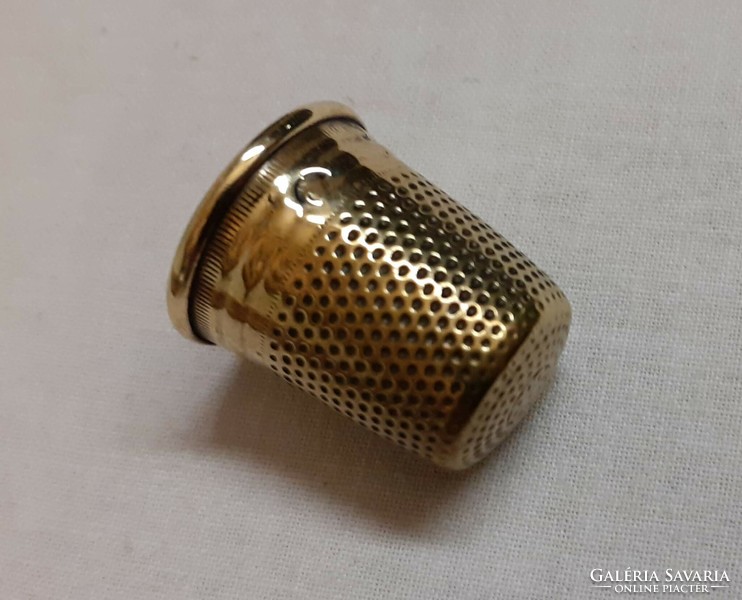 Old brass thimble in good condition