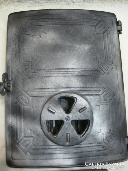 Large cast iron, tile stove, stove door