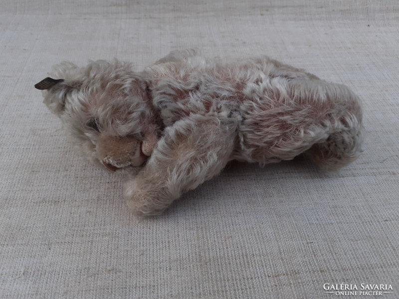 Antique mohair straw teddy bear with long paws on felt sole and paw glass eye with long nose