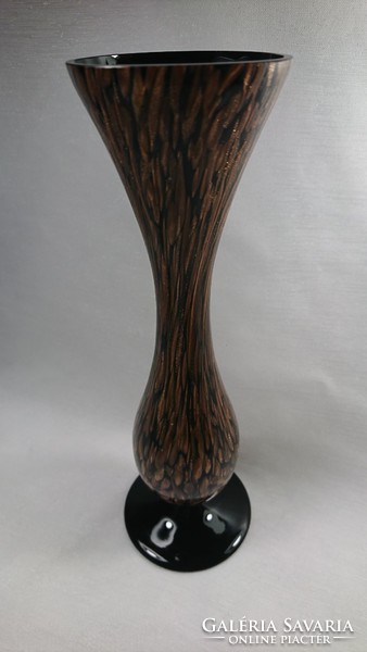 In the second half of Xx.Szd a glass vase decorated with a gold pattern on the outside was made on a black background