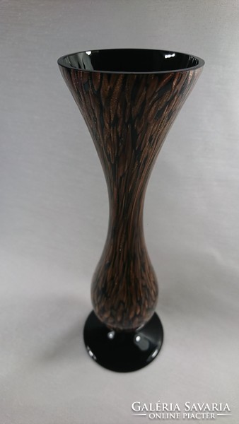 In the second half of Xx.Szd a glass vase decorated with a gold pattern on the outside was made on a black background