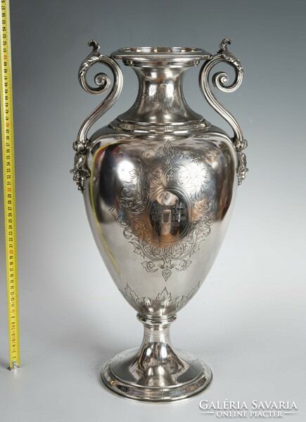 Large silver vase with plastic vine tongs
