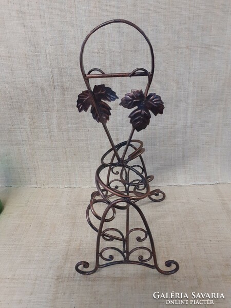 An elegant table drink holder with a grape leaf pattern in a nice condition