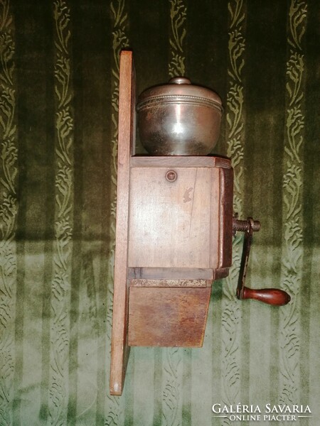 Antique, wall-mounted coffee grinder