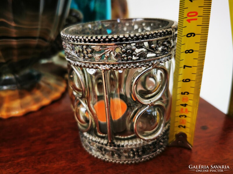 Glass candle holder in a metal frame