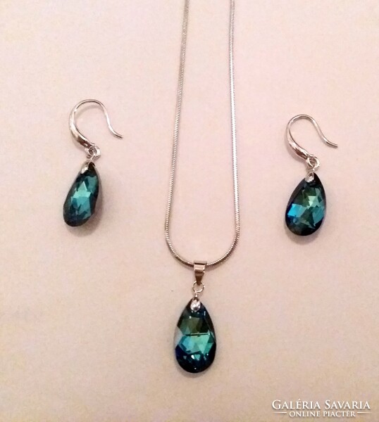 Pair of earrings, necklace, pendant in a shiny blue jewelry box