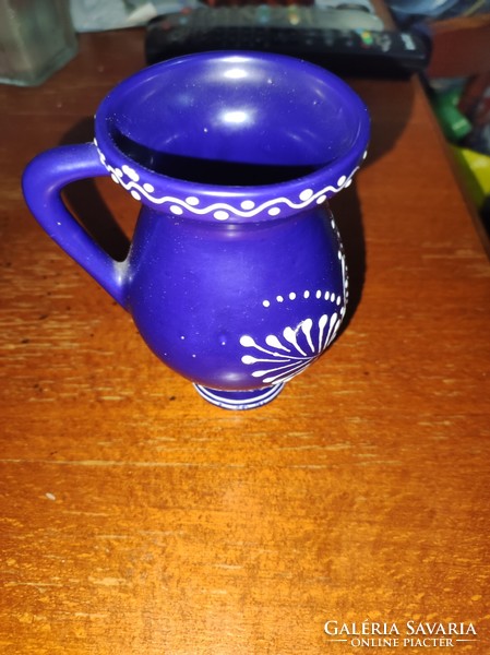 Blue ceramic jug with white hand painting