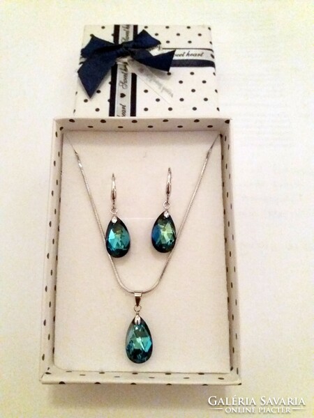 Pair of earrings, necklace, pendant in a shiny blue jewelry box