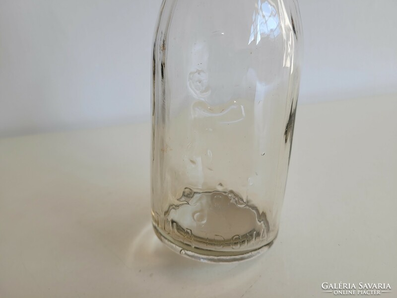Old retro embossed milk glass milk bottle