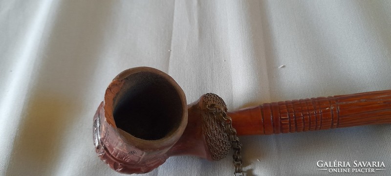 Old ceramic pipe with carved stem