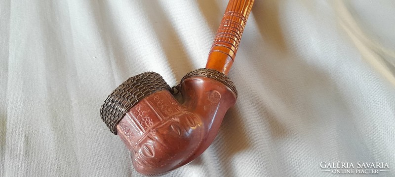 Old ceramic pipe with carved stem