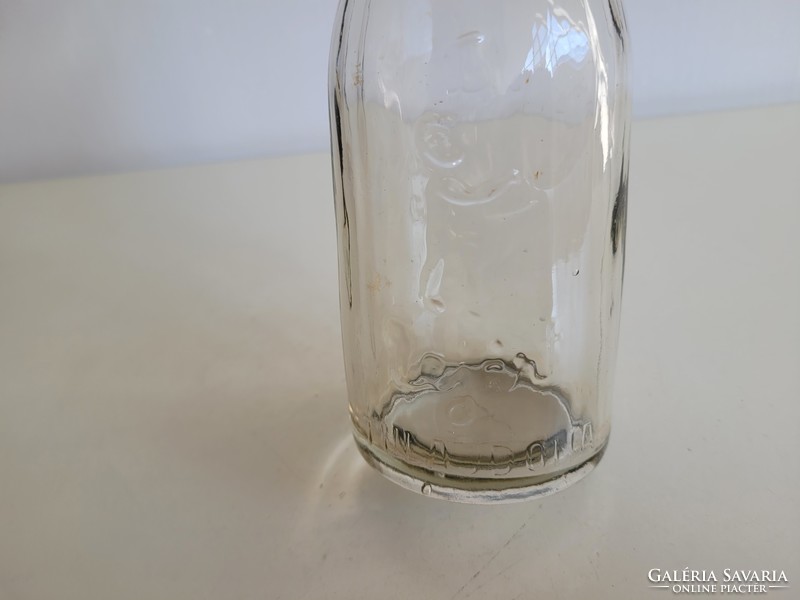 Old retro embossed milk glass milk bottle