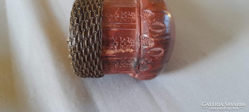 Old ceramic pipe with carved stem