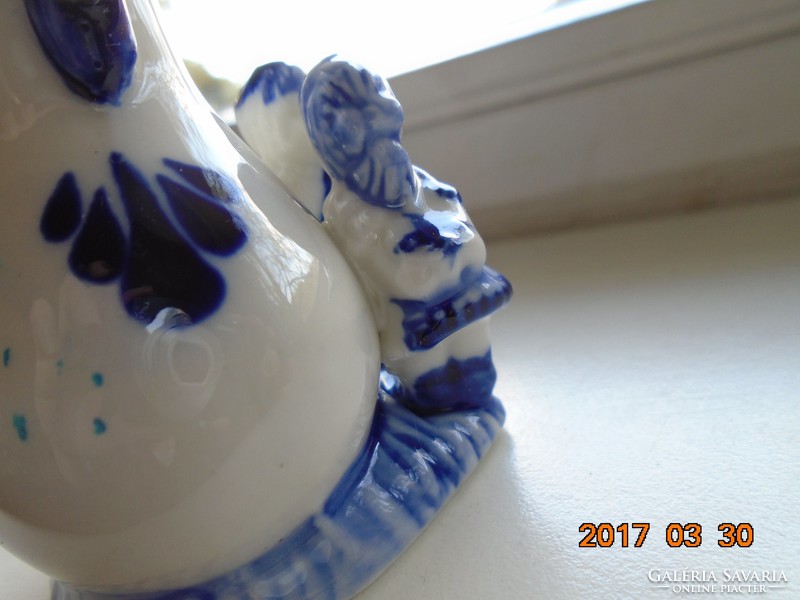 Small vase with children's figures painted in cobalt blue under the glaze