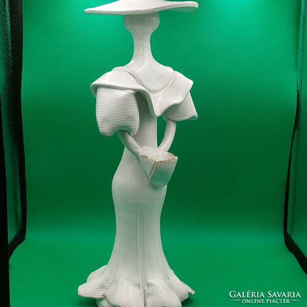 Rare collectible ceramic figure of a lady in a hat with a basket