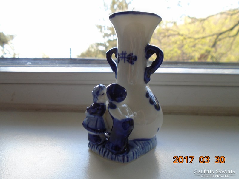 Small vase with children's figures painted in cobalt blue under the glaze